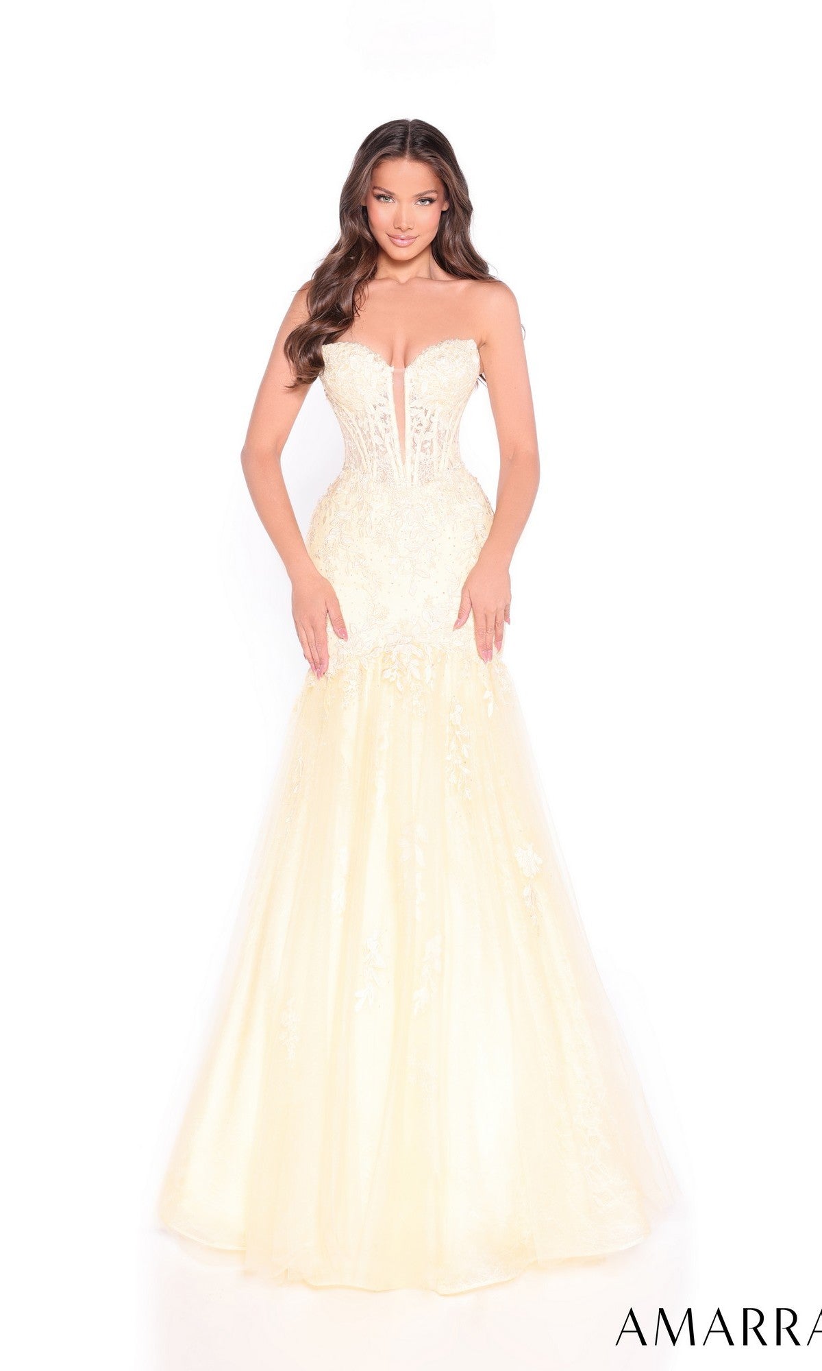 A woman models the Amarra 89319 long prom dress, a strapless gown with a cream-colored mermaid tulle skirt, intricate lace detailing, and a sheer bodice, set against a white background.